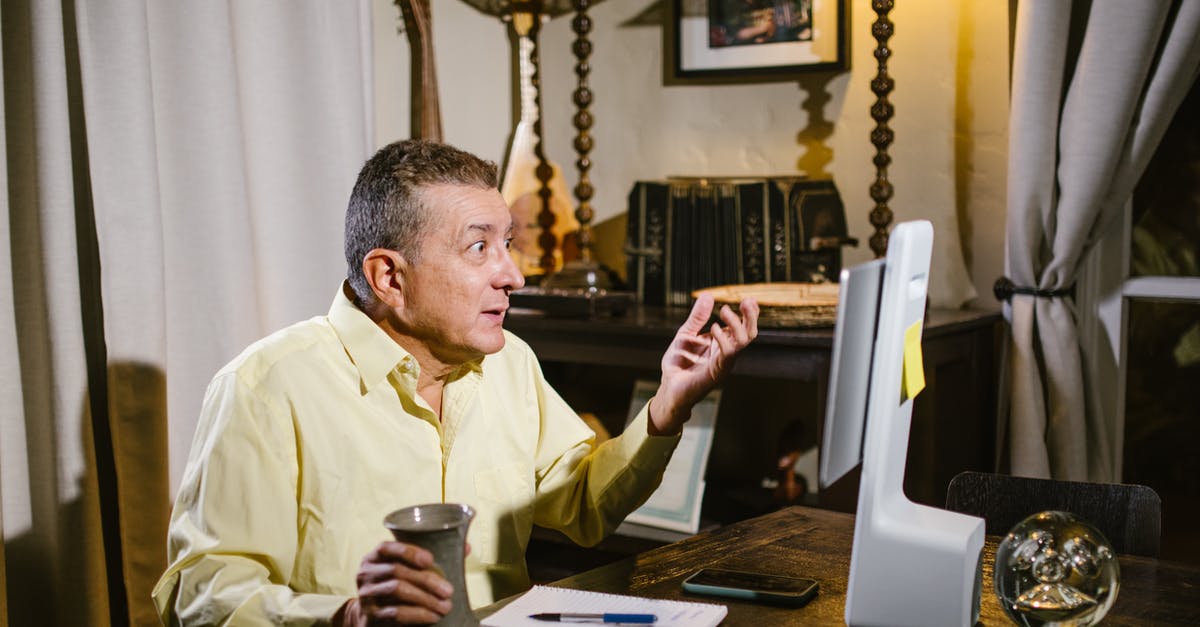 What are yellow sushi radishes called? - Man Wearing Yellow Dress Shirt Holding a Cup Looking at a Computer Screen What are yellow sushi radishes called? - Man Wearing Yellow Dress Shirt Holding a Cup Looking at a Computer Screen