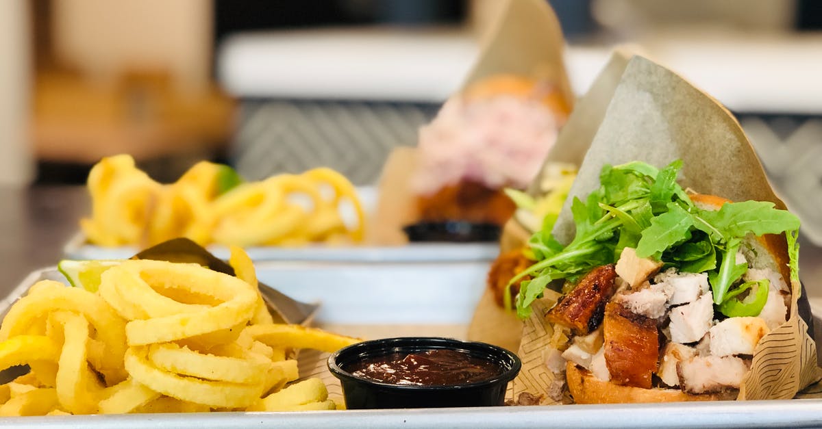 What can be added to veggie burgers to increase texture? - Burger and Fries on White Ceramic Tray What can be added to veggie burgers to increase texture? - Burger and Fries on White Ceramic Tray