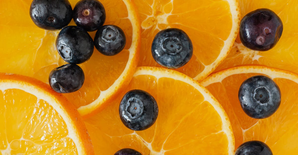 What can I mix with a sweet liquor to cut its sweetness? [duplicate] - Blueberries placed on orange slices