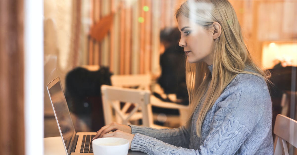 What can I use instead of a tea towel? - Serious young woman using netbook while having hot drink in modern cafe What can I use instead of a tea towel? - Serious young woman using netbook while having hot drink in modern cafe