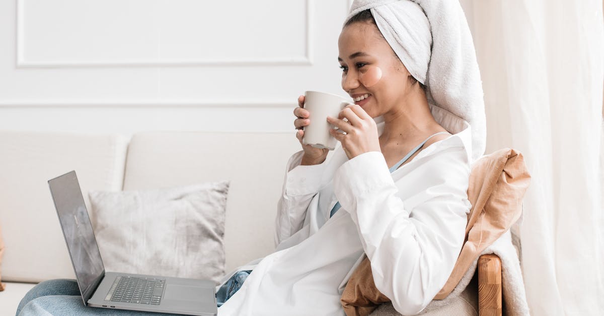 What can I use instead of a tea towel? - A Woman Looking at a Laptop While Holding a Mug What can I use instead of a tea towel? - A Woman Looking at a Laptop While Holding a Mug