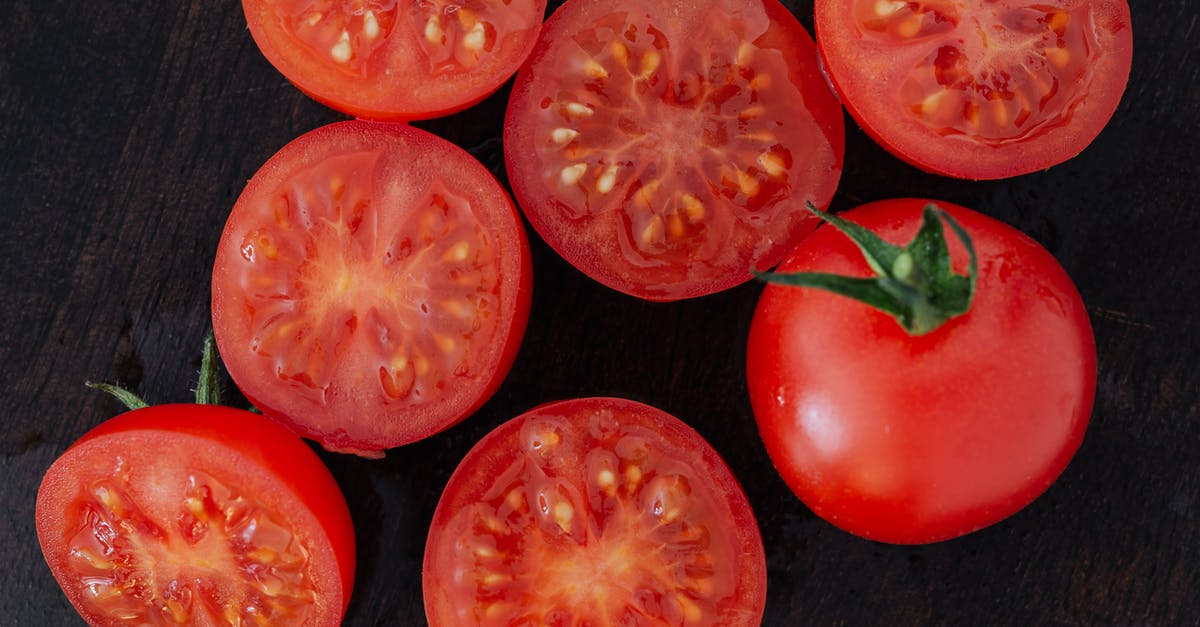 What can I use to replace the tomato juice in gazpacho? - Halves of tomatoes and whole tomato on cutting board What can I use to replace the tomato juice in gazpacho? - Halves of tomatoes and whole tomato on cutting board
