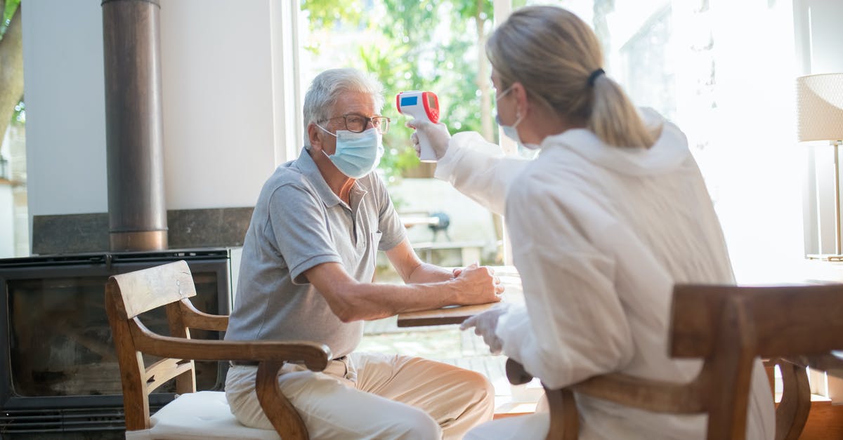 What can you do with an infrared thermometer? - A Person Scanning the Temperature of a Man with a Laser Thermometer What can you do with an infrared thermometer? - A Person Scanning the Temperature of a Man with a Laser Thermometer