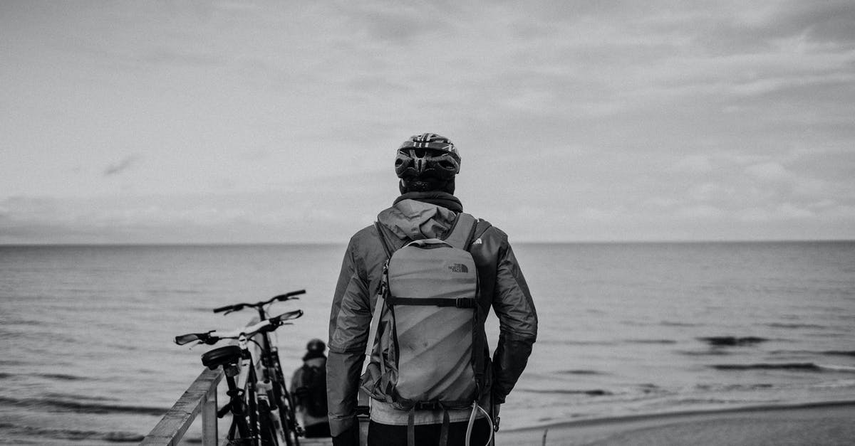 What causes air pockets in crepes? - Black and white back view of anonymous male bicyclists with rucksacks and hand in pocket admiring ocean under cloudy sky What causes air pockets in crepes? - Black and white back view of anonymous male bicyclists with rucksacks and hand in pocket admiring ocean under cloudy sky