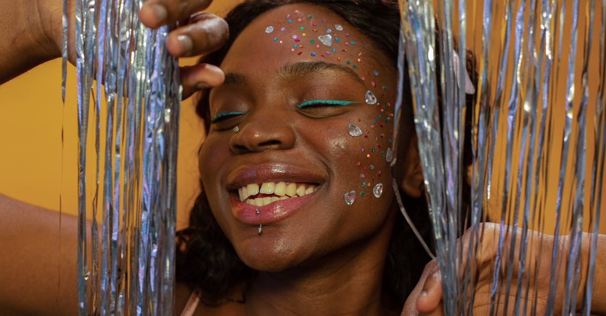What causes odd off-flavor/smell in tofu? - Happy black woman with makeup and sequins on face What causes odd off-flavor/smell in tofu? - Happy black woman with makeup and sequins on face