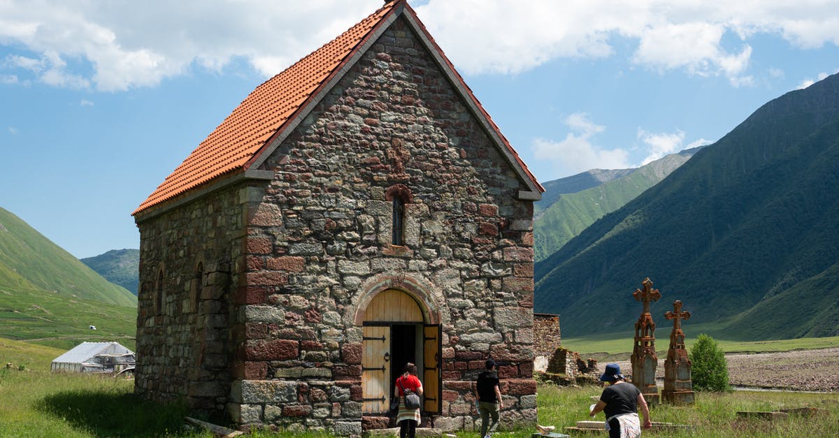 What could be the history of this pan? - People Walking into an Old Church What could be the history of this pan? - People Walking into an Old Church