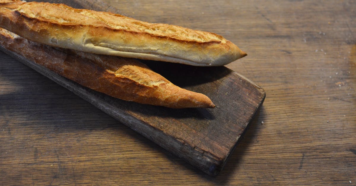 What defines a bread as 'artisan'? - Brown Bread on the Wooden Tray What defines a bread as 'artisan'? - Brown Bread on the Wooden Tray