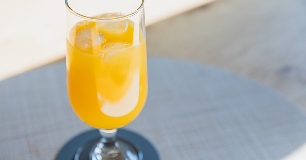 What determines if a juice is clear or opaque? - Glass of cold yellow drink for refreshing What determines if a juice is clear or opaque? - Glass of cold yellow drink for refreshing