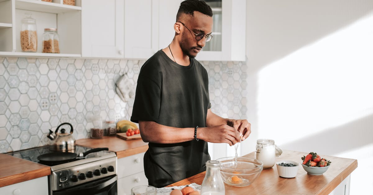 What did European/American historical cooks do with the egg whites? - 
A Man in a Black Shirt Cracking an Egg