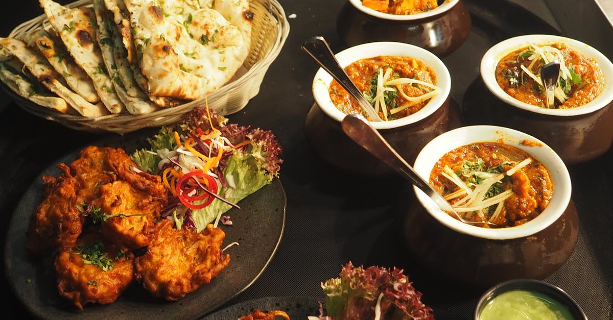 What dishes are paired with agnolini in Mantuan cuisine? - White and Brown Cooked Dish on White Ceramic Bowls What dishes are paired with agnolini in Mantuan cuisine? - White and Brown Cooked Dish on White Ceramic Bowls