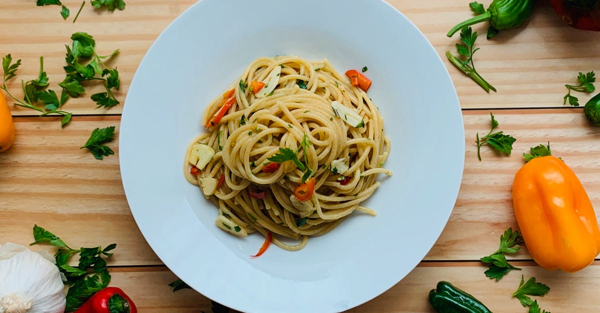 What do these additions to common spice mixes do with your dish? - Yummy pasta with veggies placed on table near scattered peppers and spices What do these additions to common spice mixes do with your dish? - Yummy pasta with veggies placed on table near scattered peppers and spices