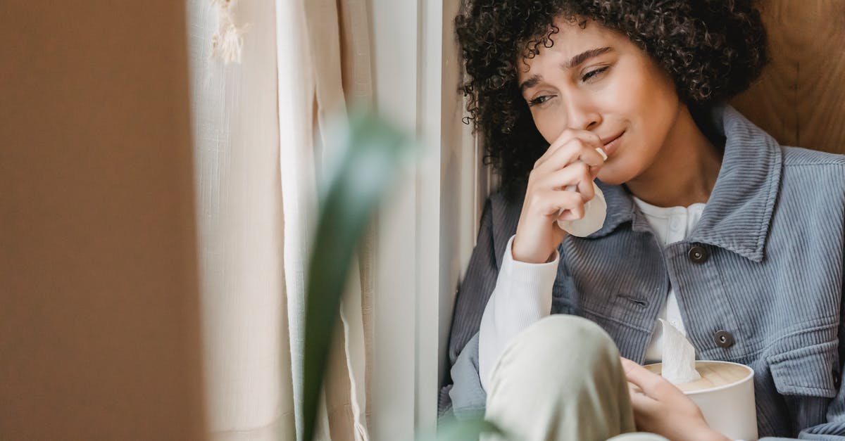 What does bad Brie smell/taste like? - Sad African American female with tissue sitting on windowsill and crying while suffering from sorrow What does bad Brie smell/taste like? - Sad African American female with tissue sitting on windowsill and crying while suffering from sorrow