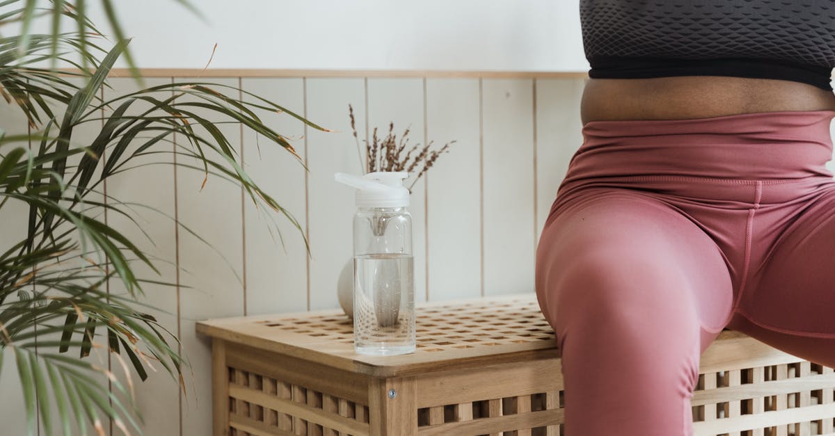 What does resting mean - Woman in Black Tank Top and Red Skirt Sitting on Brown Wooden Chair What does resting mean - Woman in Black Tank Top and Red Skirt Sitting on Brown Wooden Chair