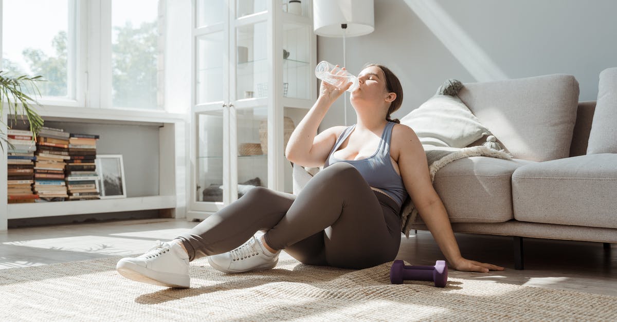What does resting mean - Woman in Blue and White Tank Top and Black Shorts Sitting on White Couch What does resting mean - Woman in Blue and White Tank Top and Black Shorts Sitting on White Couch