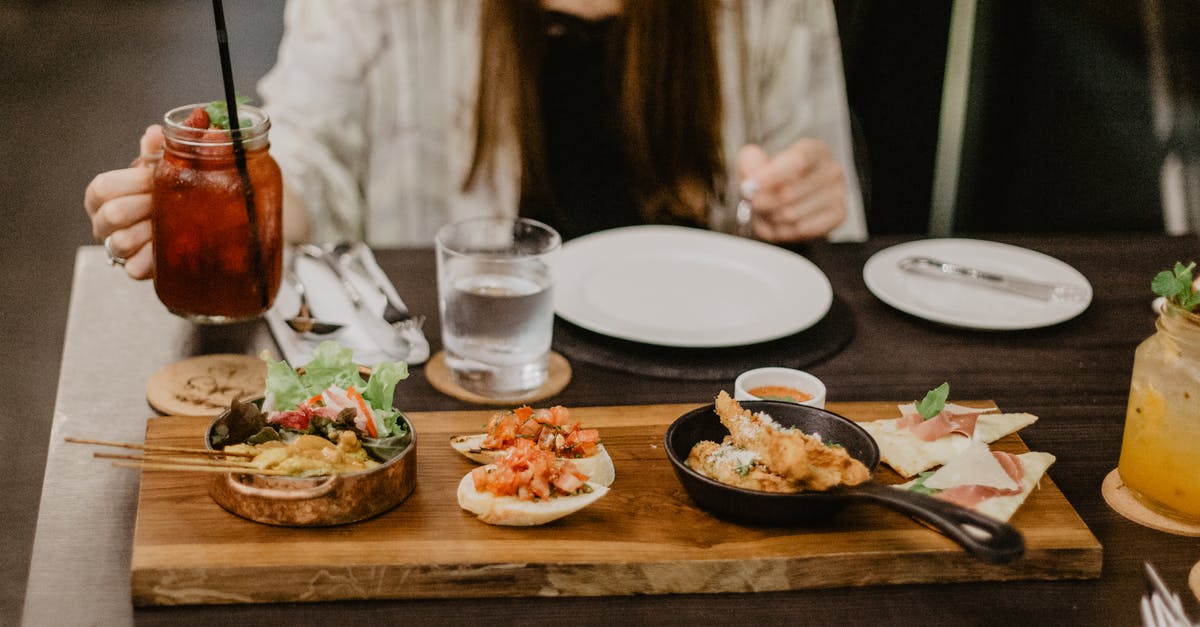 What does sourdough starter REALLY need? - Crop unrecognizable female in casual clothes having dinner in Asian restaurant while sitting at table with berry mocktail and grilled meat on sticks served with tomato sandwiches and spring rolls What does sourdough starter REALLY need? - Crop unrecognizable female in casual clothes having dinner in Asian restaurant while sitting at table with berry mocktail and grilled meat on sticks served with tomato sandwiches and spring rolls