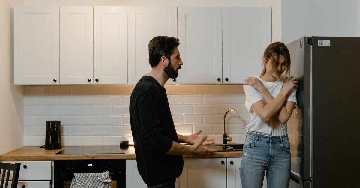 What does the refrigerator crisper compartment actually do? - Man and Woman Having a Quarrel at the Kitchen What does the refrigerator crisper compartment actually do? - Man and Woman Having a Quarrel at the Kitchen