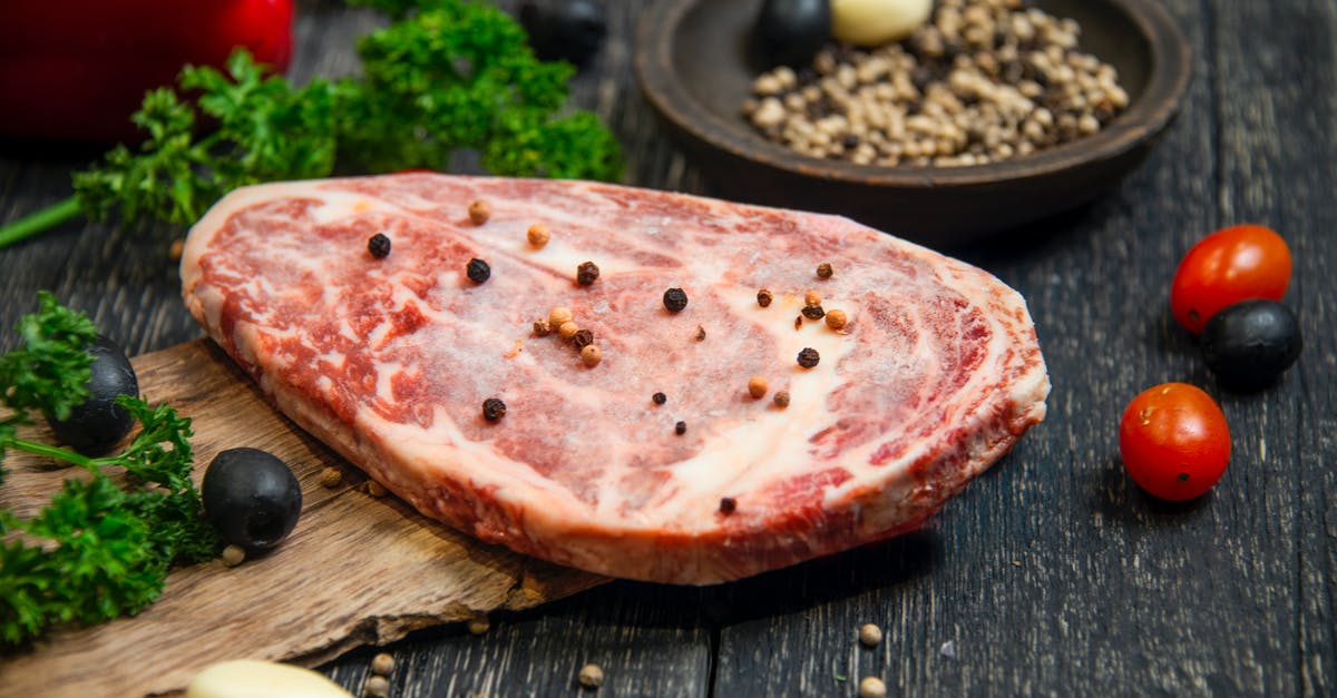 What doneness is this steak? - Sliced Pizza on Black Wooden Table