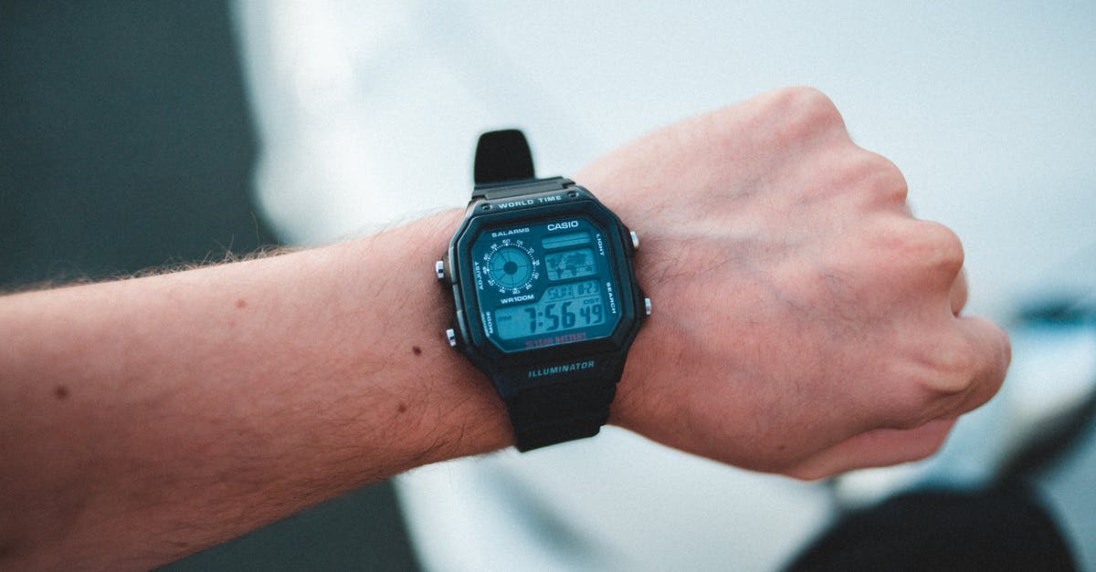 What features are important in a hand mixer? - Man demonstrating modern electronic wristwatch