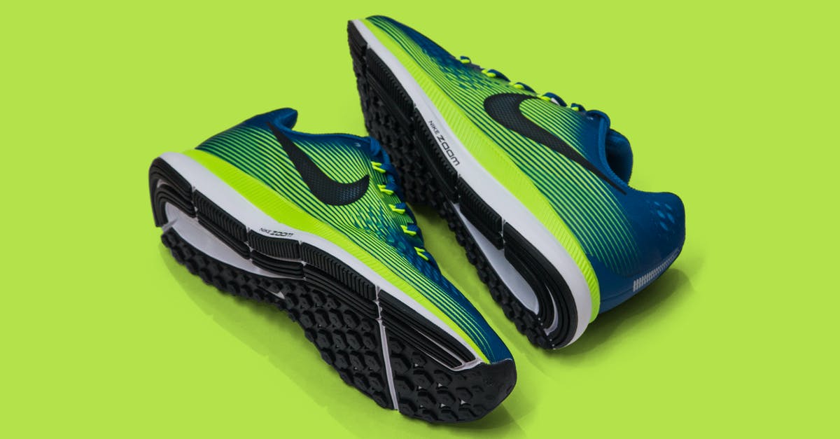 What fruit pair well with spinach? - From above of colored sneakers with blue and green surface and green and white and black sole for comfortable moving around streets against green background What fruit pair well with spinach? - From above of colored sneakers with blue and green surface and green and white and black sole for comfortable moving around streets against green background