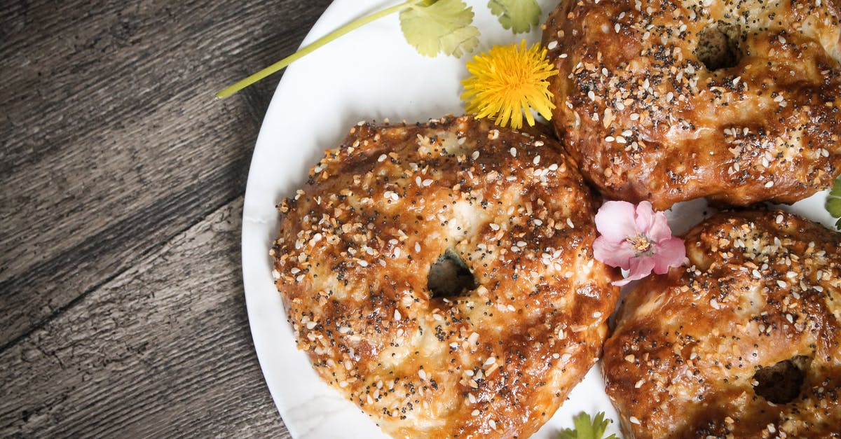 What gives a good bagel its crust? - Toast Bread with Sesame Seeds in a Plate What gives a good bagel its crust? - Toast Bread with Sesame Seeds in a Plate