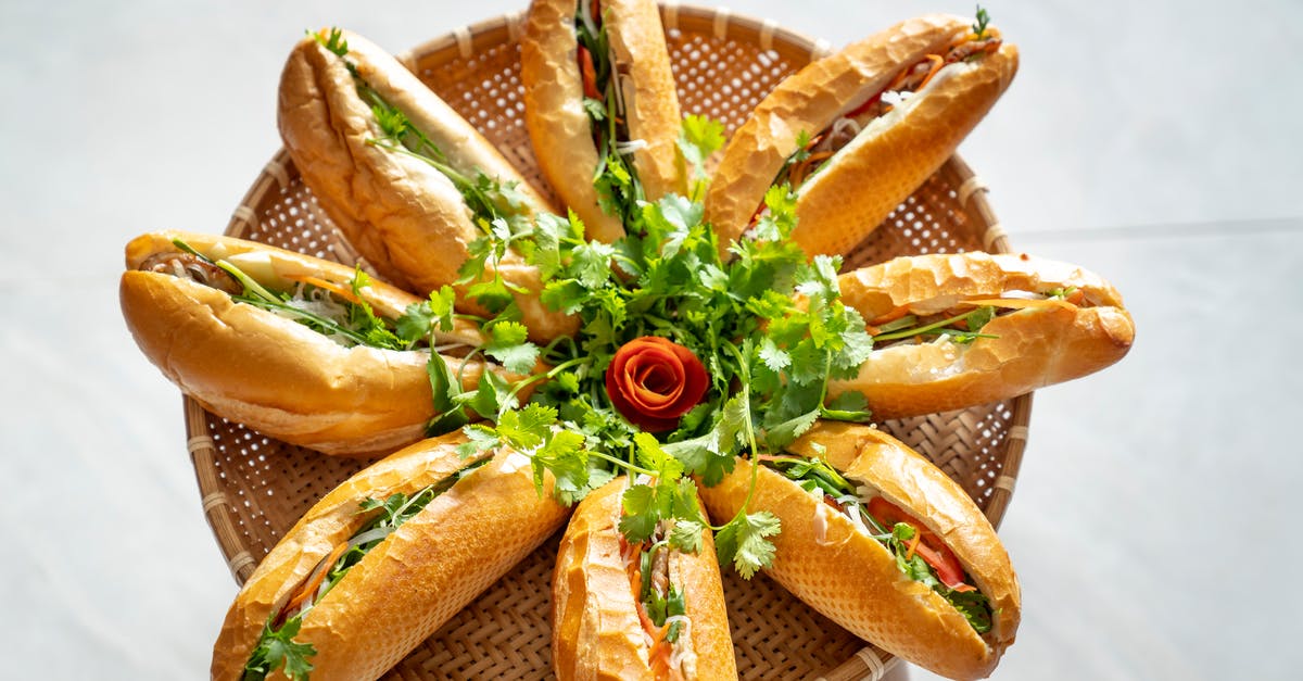 What gives arugula (wild rocket) its distinct taste? - Sandwiches decorated with green arugula leaves What gives arugula (wild rocket) its distinct taste? - Sandwiches decorated with green arugula leaves