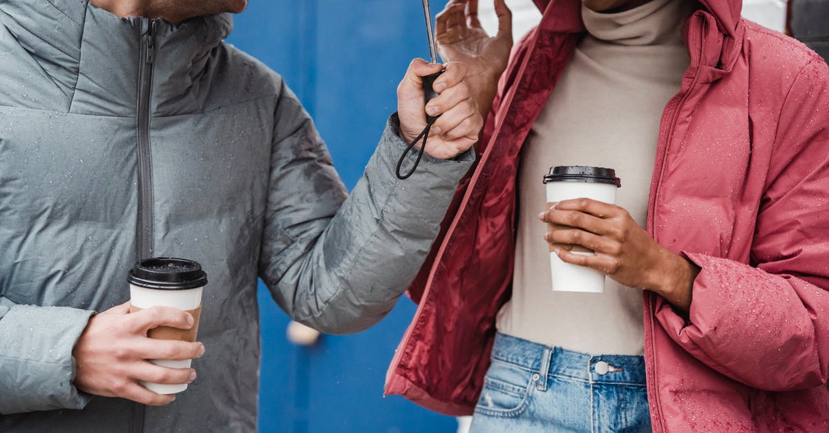 What green tea has the highest caffeine content? - Crop multiethnic couple with coffee on rainy day What green tea has the highest caffeine content? - Crop multiethnic couple with coffee on rainy day