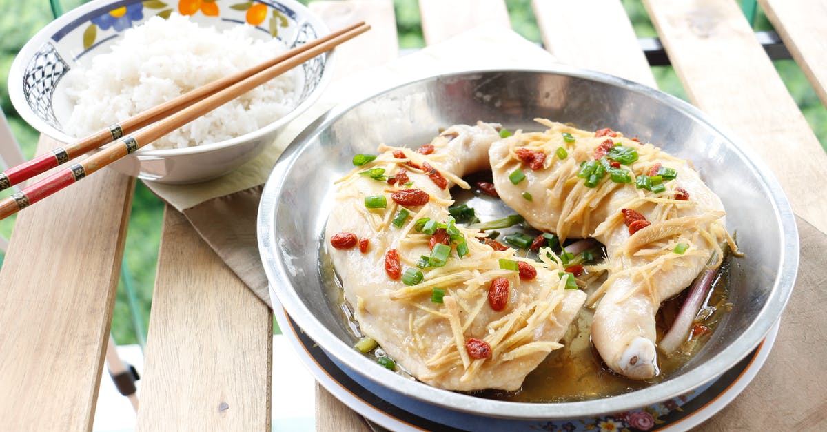 What herbs and spices are used in Kentucky Fried Chicken? - A Chicken Dish and Bowl of Rice on Wooden Table What herbs and spices are used in Kentucky Fried Chicken? - A Chicken Dish and Bowl of Rice on Wooden Table