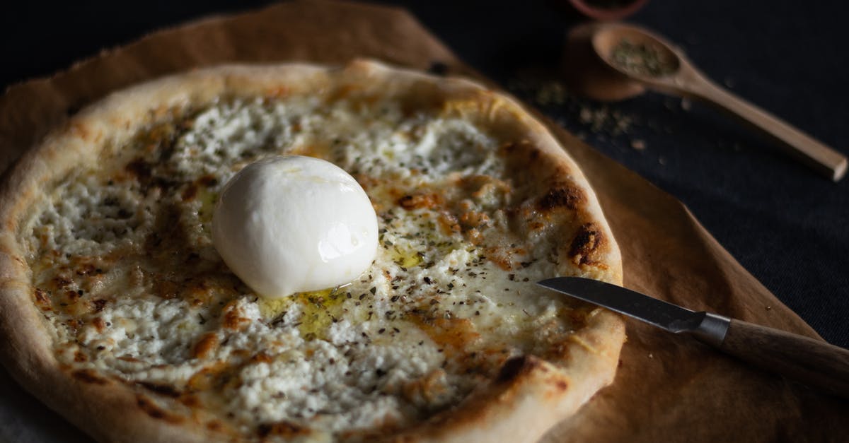 What herbs to use when baking bread, rusks and scones? - Creamy Cheese Pizza in Close-up Shot What herbs to use when baking bread, rusks and scones? - Creamy Cheese Pizza in Close-up Shot