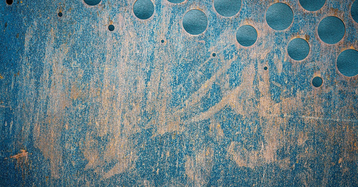 What hole size to prefer in the bread for what reasons? - Abstract background of grunge wall with round holes What hole size to prefer in the bread for what reasons? - Abstract background of grunge wall with round holes
