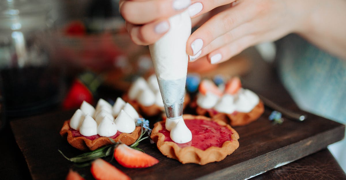 What ingredient should I add to my cookies to increase shelf life? - Crop anonymous female adding cream on homemade cookies with strawberries placed on wooden board in kitchen in daylight What ingredient should I add to my cookies to increase shelf life? - Crop anonymous female adding cream on homemade cookies with strawberries placed on wooden board in kitchen in daylight