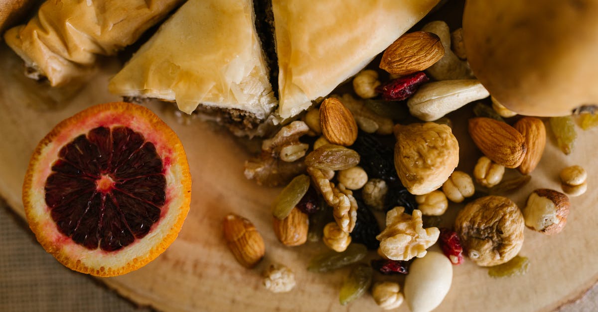 What ingredients can I add to no-knead bread to extend its life? - Sliced Bread And Nuts on Wooden Board What ingredients can I add to no-knead bread to extend its life? - Sliced Bread And Nuts on Wooden Board