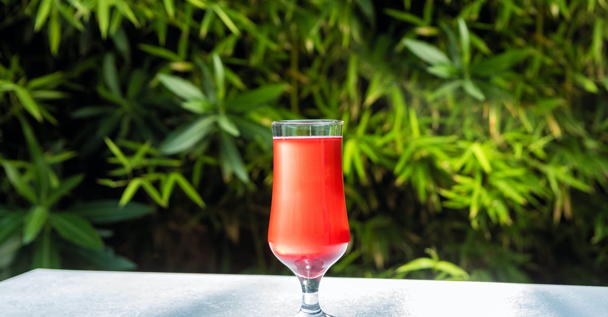 What is 100% juice? - Clear Wine Glass With Red Liquid on White Table What is 100% juice? - Clear Wine Glass With Red Liquid on White Table