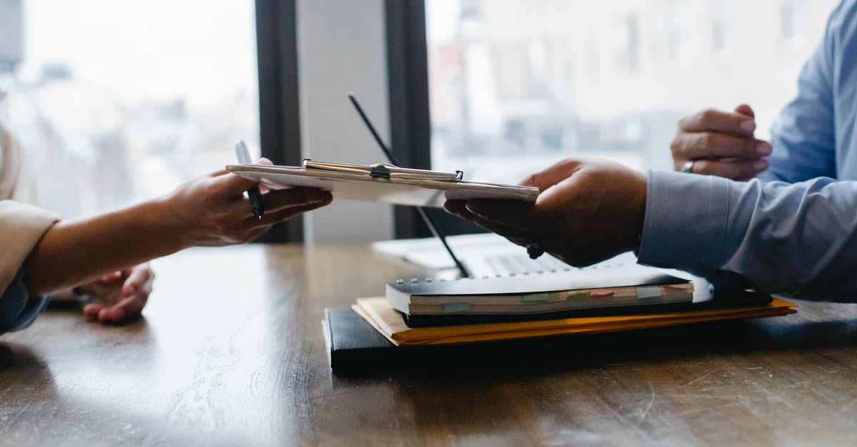 What is 91/100 CV when referring to olives? - Crop anonymous ethnic woman passing clipboard to office worker with laptop during job interview What is 91/100 CV when referring to olives? - Crop anonymous ethnic woman passing clipboard to office worker with laptop during job interview