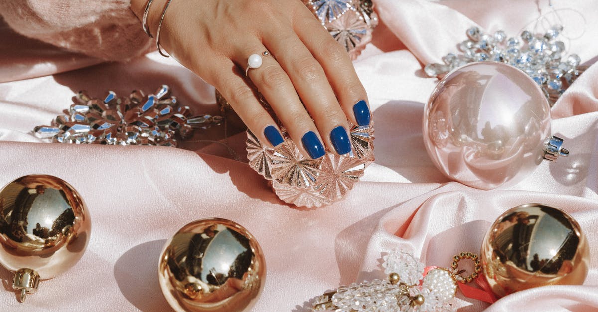 What is a 'parmigiano pearl'? - Person Wearing Gold Ring and Blue Manicure What is a 'parmigiano pearl'? - Person Wearing Gold Ring and Blue Manicure