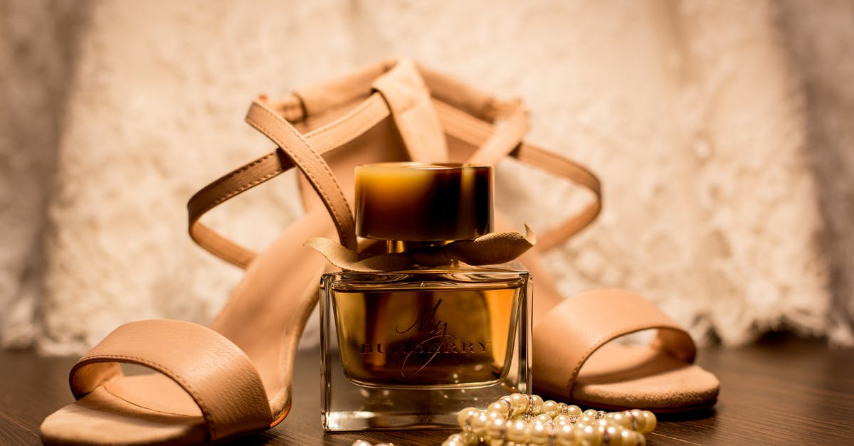 What is a 'parmigiano pearl'? - Brown Glass Fragrance Bottle Beside White Pearl Bracelets What is a 'parmigiano pearl'? - Brown Glass Fragrance Bottle Beside White Pearl Bracelets