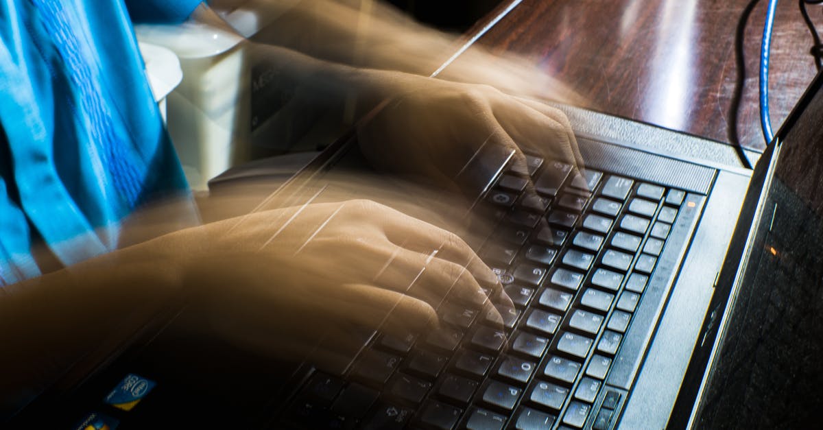 What is a device used to slice tomatoes with in one motion called? - Crop unrecognizable man typing on laptop What is a device used to slice tomatoes with in one motion called? - Crop unrecognizable man typing on laptop