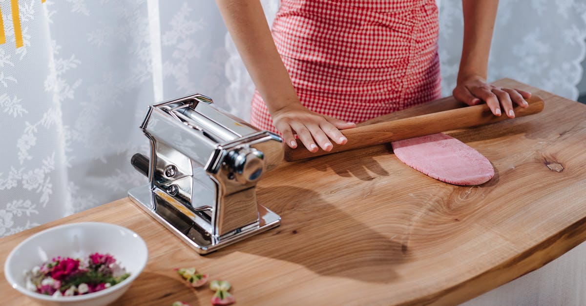 What is a French Rolling Pin? - Woman Rolling Pasta What is a French Rolling Pin? - Woman Rolling Pasta