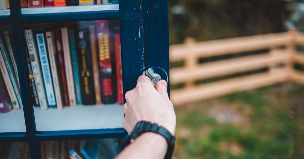 What is a good website or book to learn kitchen techniques? [closed] - Crop person opening public bookcase in park