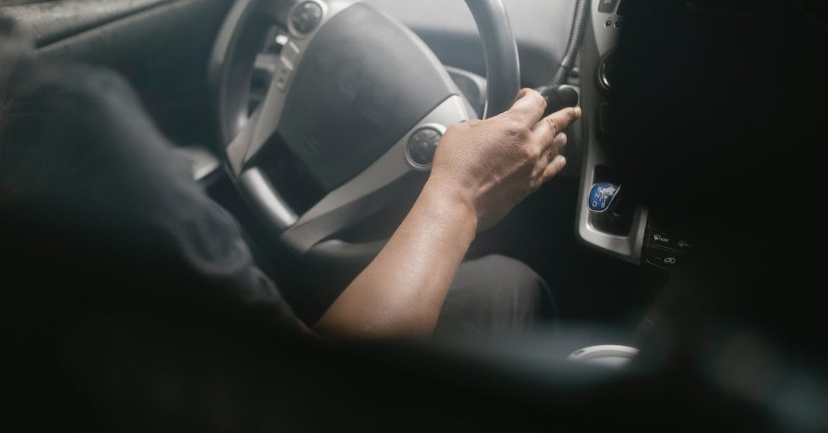 What is an easy way to turn a heavy-ish cake? - High angle of crop unrecognizable male driving modern car on street on sunny day What is an easy way to turn a heavy-ish cake? - High angle of crop unrecognizable male driving modern car on street on sunny day