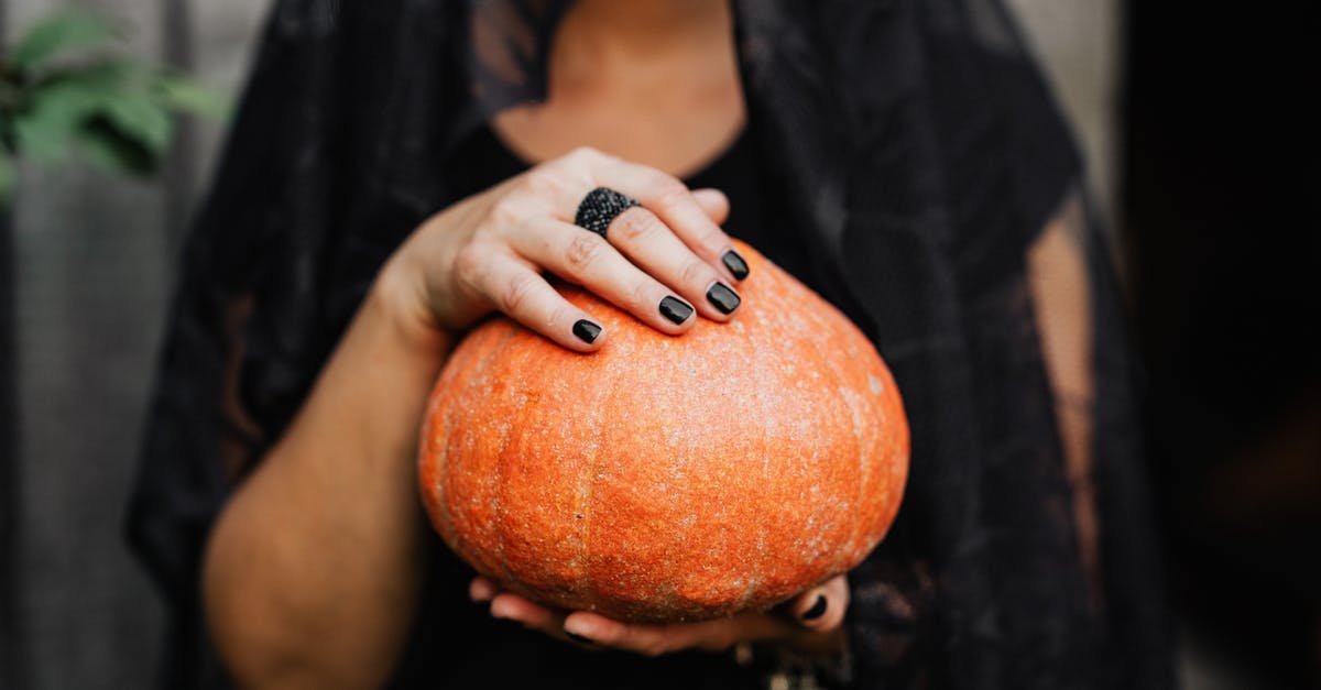 What is Bosnian black honey? - Woman in Black Manicure Holding Orange Fruit What is Bosnian black honey? - Woman in Black Manicure Holding Orange Fruit