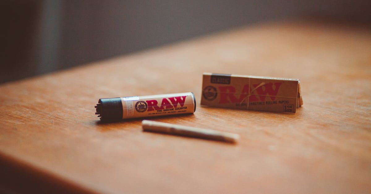 What is filter paper? - Roll up cigarette and lighter placed on table What is filter paper? - Roll up cigarette and lighter placed on table
