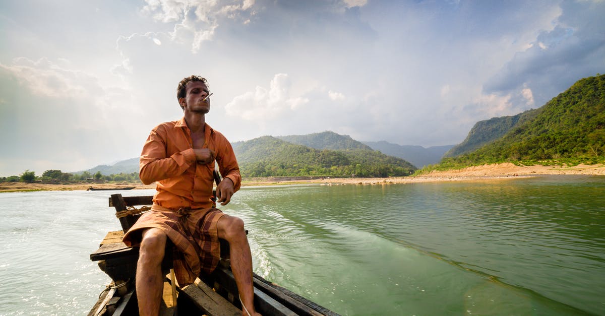 What is good water-pan placement for offset smoker - Photo of Man Sitting on Motor Boat What is good water-pan placement for offset smoker - Photo of Man Sitting on Motor Boat