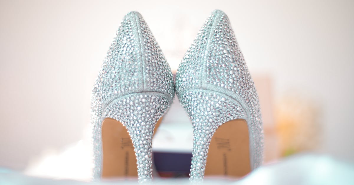 What is Heel of Round? - Stylish wedding high heels decorated with shiny silver rhinestones placed on white fabric