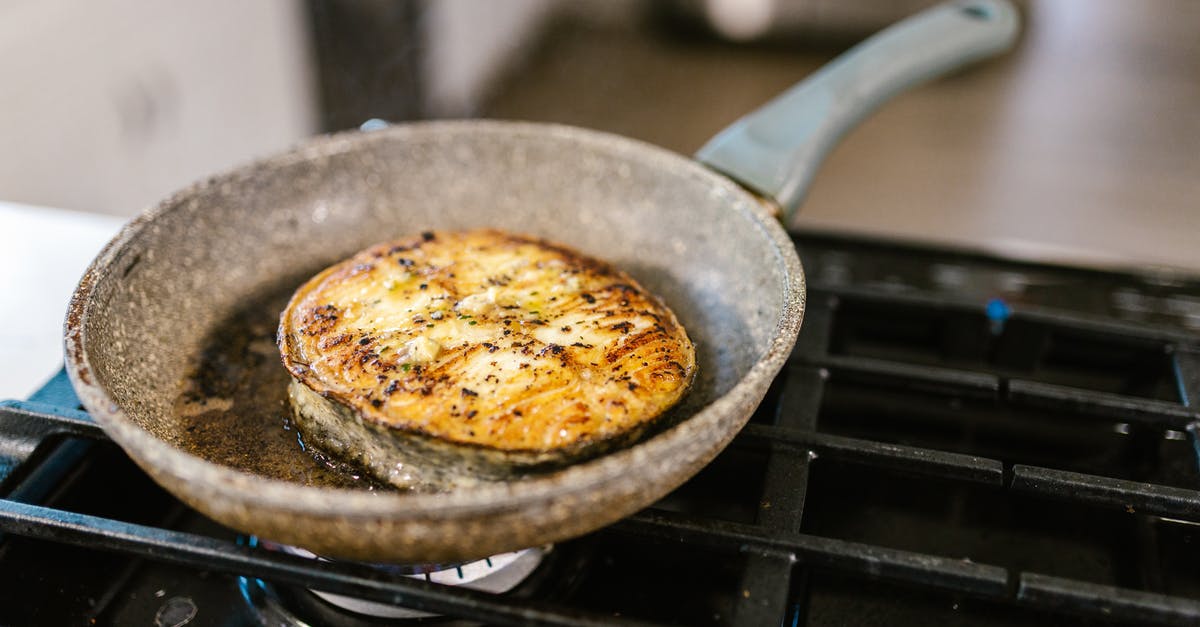 What is helping fried fish have more flavour? - Well Fried Fish Slice on Frying Pan