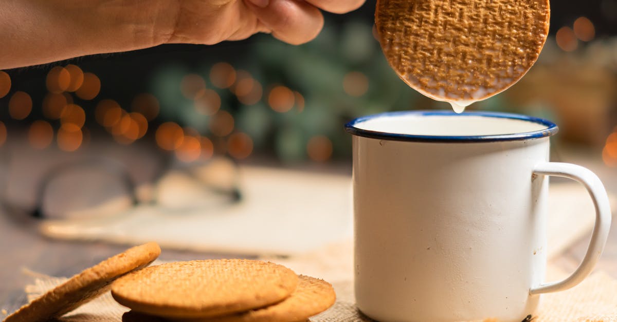 What is it about milk that makes it go well with cookies? [closed] - Person Holding Cookie