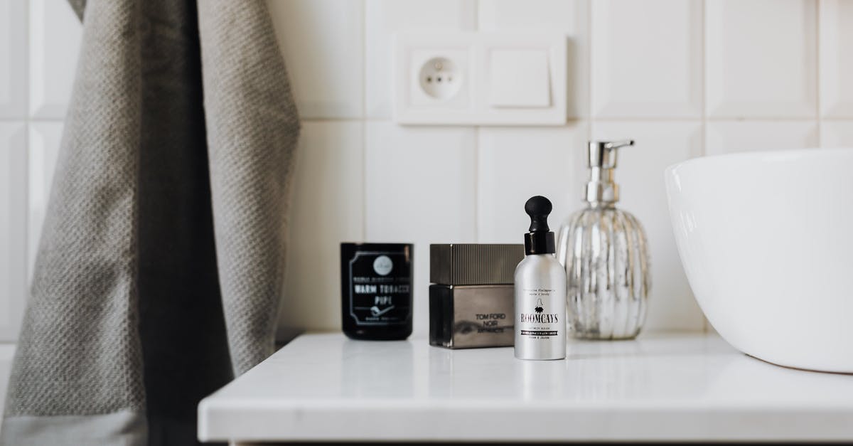 What is Light Cream - Personal care supplies on cabinet in stylish bathroom What is Light Cream - Personal care supplies on cabinet in stylish bathroom