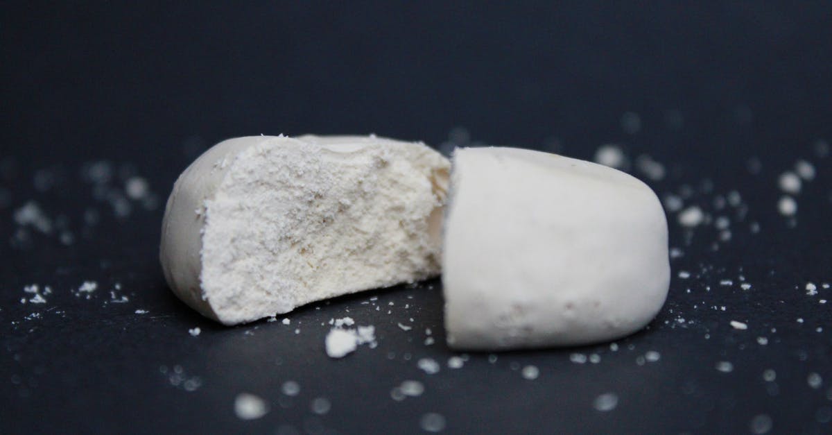 What is milk product in cocoa butter? - White and Brown Bread on Black Surface What is milk product in cocoa butter? - White and Brown Bread on Black Surface