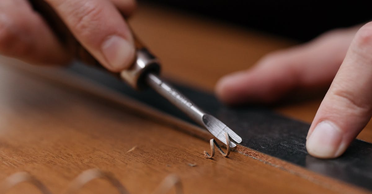 What is that tool called for scraping vegetables? - A Person Trimming a Wood Plank with and Edge 1 What is that tool called for scraping vegetables? - A Person Trimming a Wood Plank with and Edge 1