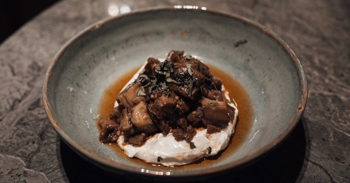 What is the 'cleanest' way to roast eggplants indoor? - Appetizing dish with eggplants and sauce served in bowl What is the 'cleanest' way to roast eggplants indoor? - Appetizing dish with eggplants and sauce served in bowl
