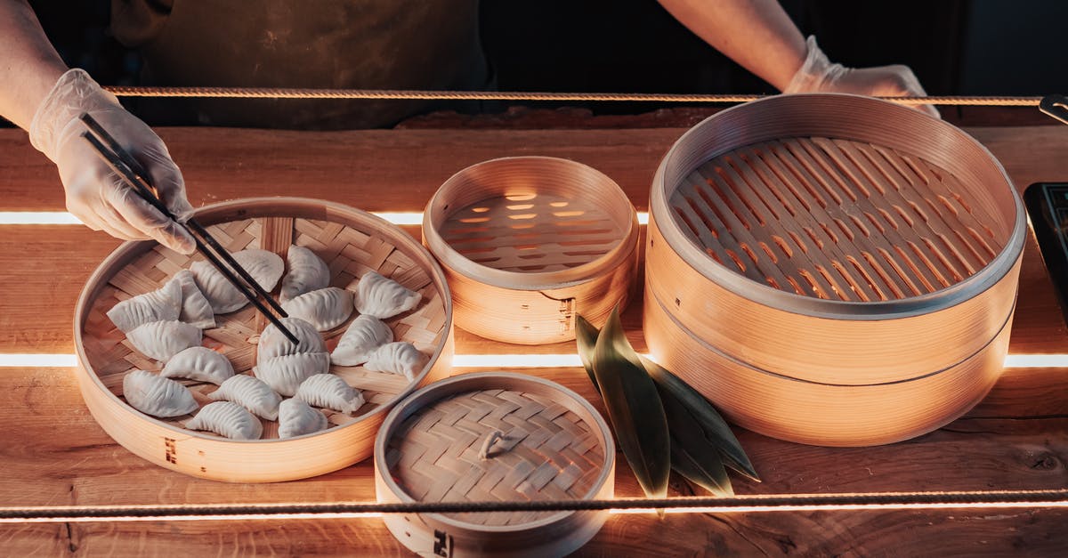 What is the 'Steam-Chill-Bake' method of making hot wings? - White Round Ceramic Bowl on Brown Wooden Tray What is the 'Steam-Chill-Bake' method of making hot wings? - White Round Ceramic Bowl on Brown Wooden Tray
